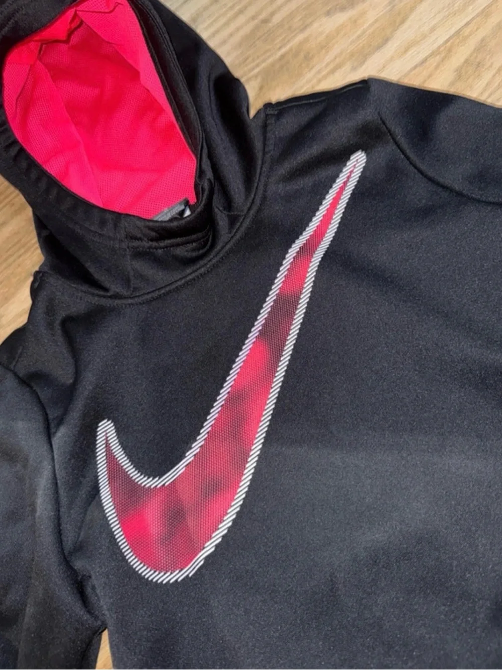 Nike Kids Black Hoodie with Pink Swoosh and pink Hood Lining